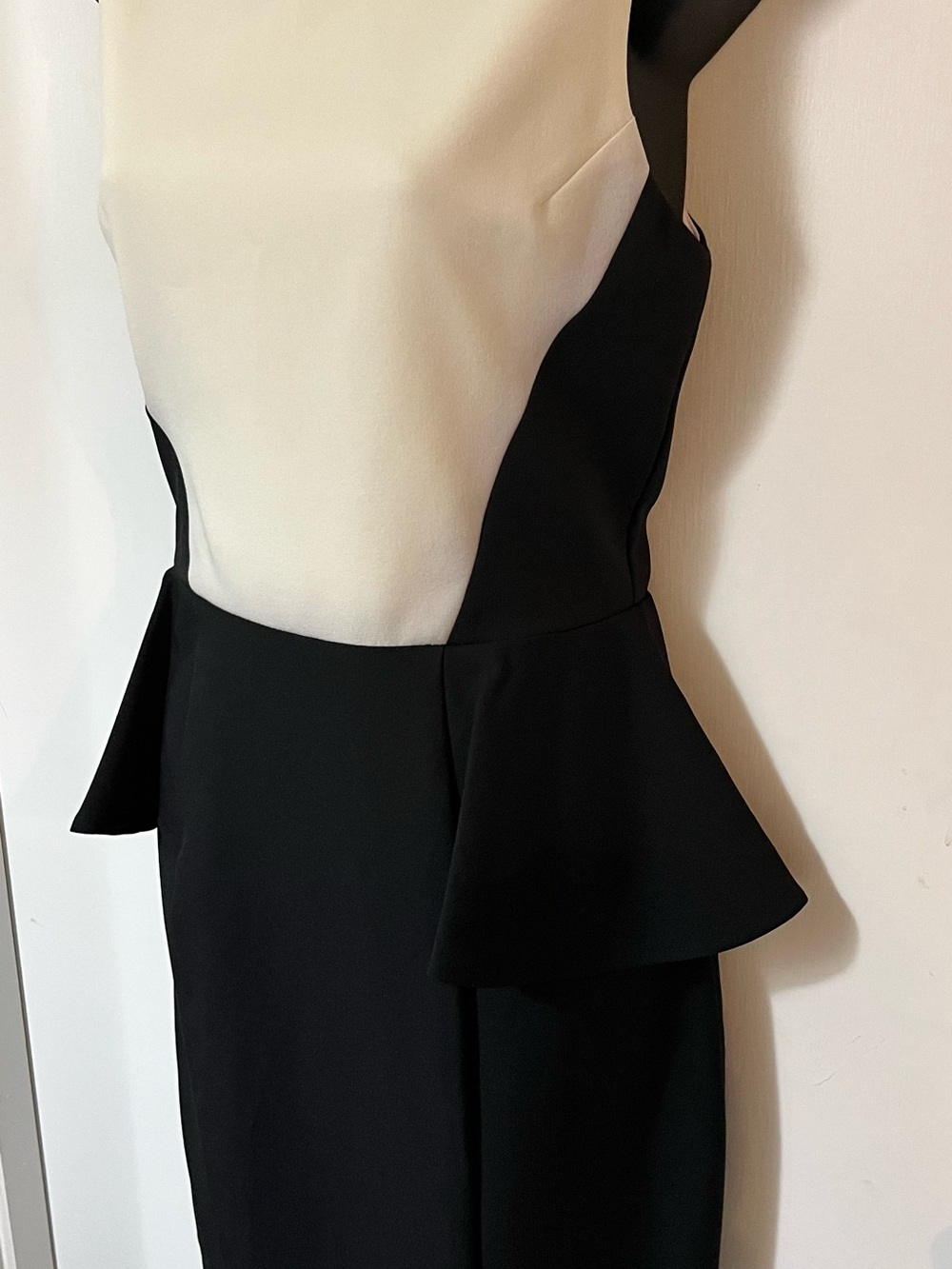 B. Smart Black and Cream Peplum Midi Sheath Dress